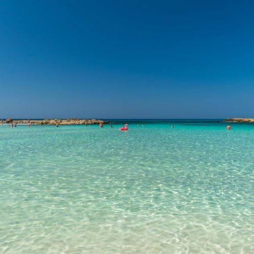 tourists-relax-swim-one-most-popular-beaches-island