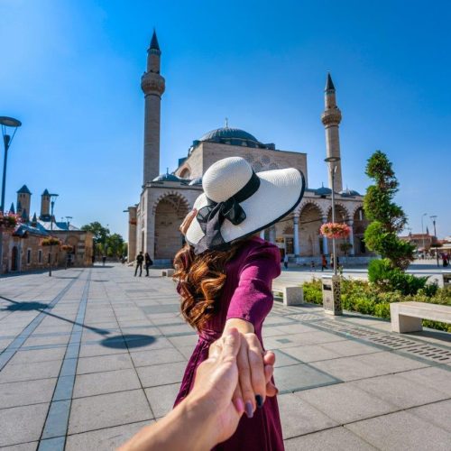 women-tourists-holding-man-s-hand-leading-him-mosque-konya-turkey