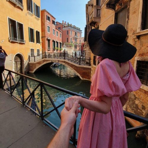 young-woman-hat-stands-with-her-back-venice